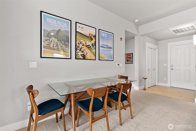 708 Market St Unit 711, Tacoma, WA 98402 - carpeted dining area with baseboards and visible vents