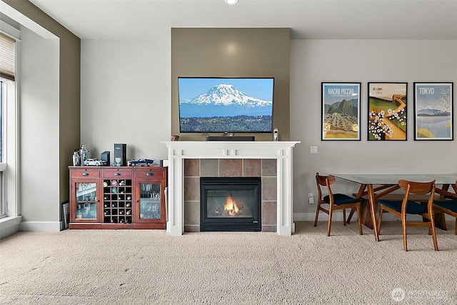 708 Market St Unit 711, Tacoma, WA 98402 - living area featuring baseboards, a fireplace, and carpet