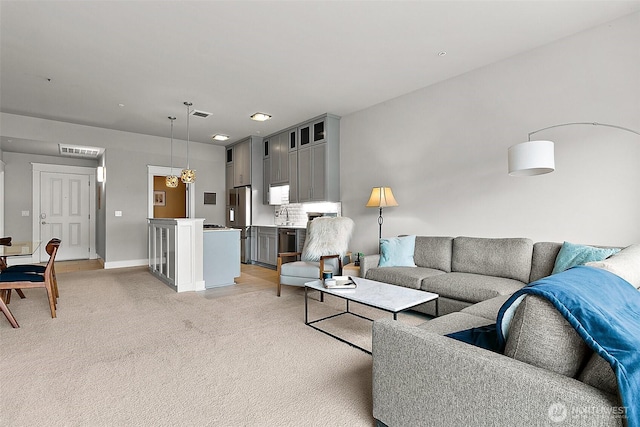 708 Market St Unit 711, Tacoma, WA 98402 - living area featuring baseboards, light colored carpet, and visible vents