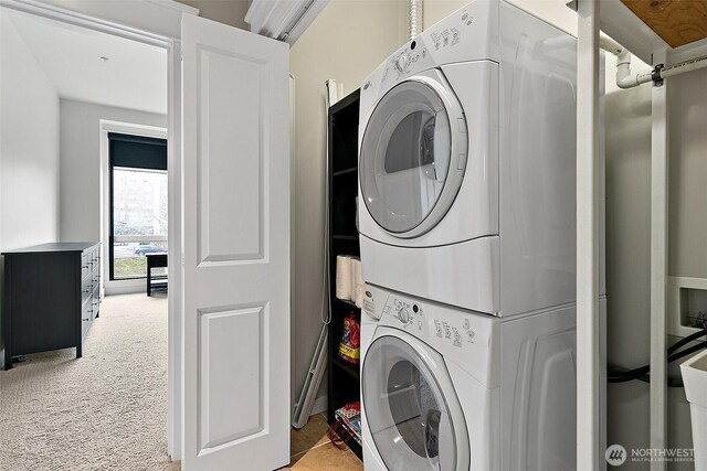 708 Market St Unit 711, Tacoma, WA 98402 - washroom featuring stacked washer and clothes dryer, laundry area, and carpet flooring
