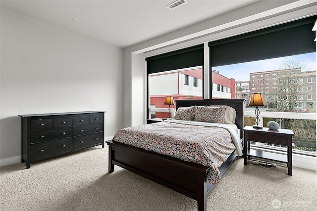 708 Market St Unit 711, Tacoma, WA 98402 - bedroom featuring baseboards, carpet floors, and visible vents