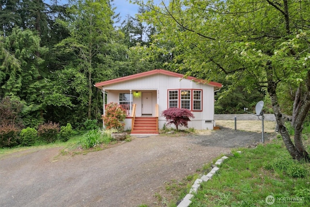 manufactured / mobile home with covered porch and driveway