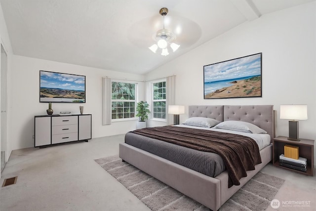 bedroom with visible vents, light colored carpet, and lofted ceiling