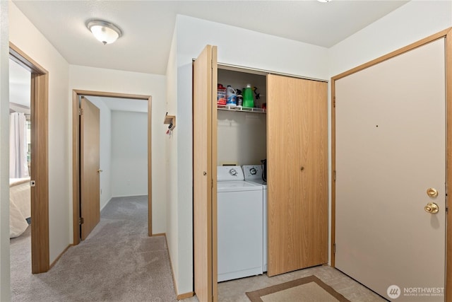 18200 73rd Ave NE Unit B103, Kenmore, WA 98028 - washroom featuring laundry area, washer and dryer, and light colored carpet