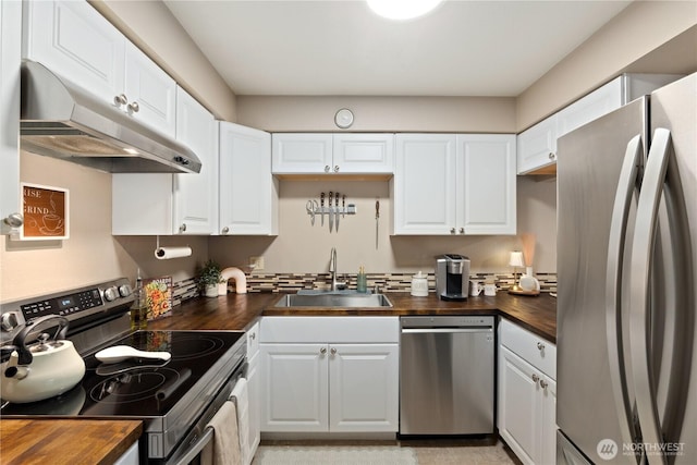 18200 73rd Ave NE Unit B103, Kenmore, WA 98028 - kitchen with a sink, white cabinetry, appliances with stainless steel finishes, under cabinet range hood, and wood counters