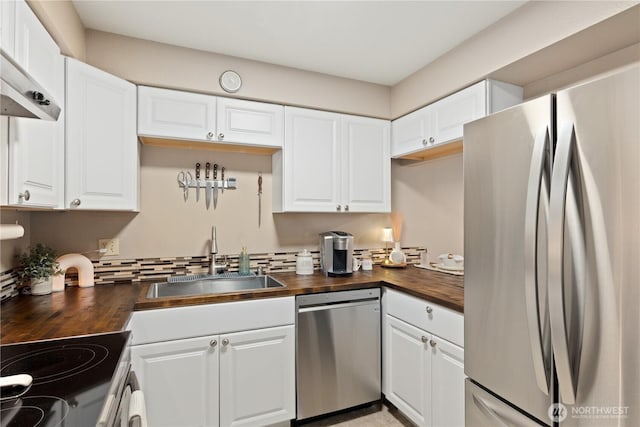 18200 73rd Ave NE Unit B103, Kenmore, WA 98028 - kitchen with wooden counters, white cabinets, a sink, and stainless steel appliances