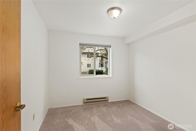 18200 73rd Ave NE Unit B103, Kenmore, WA 98028 - unfurnished room with carpet, baseboards, and a baseboard heating unit