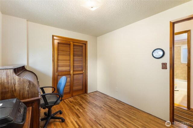 office area featuring a textured ceiling and wood finished floors