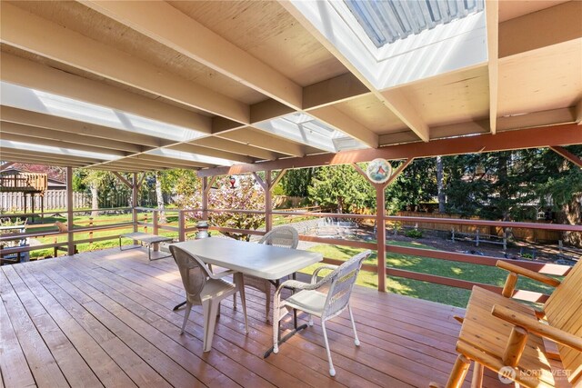 deck with fence and outdoor dining area
