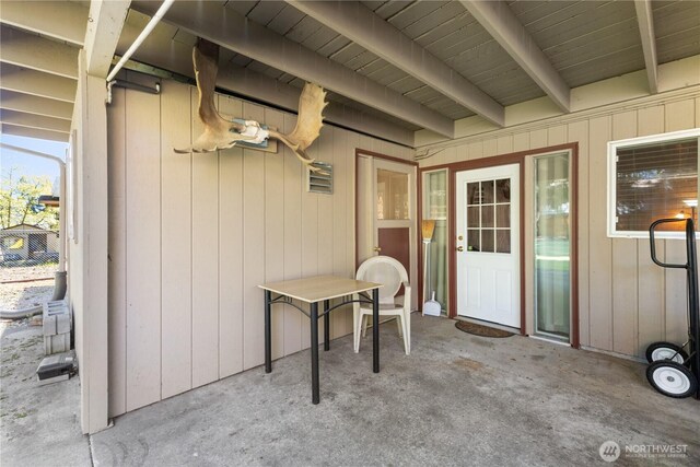 property entrance featuring a patio area