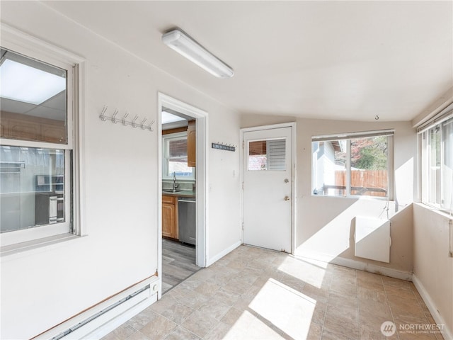 interior space with a sink and baseboard heating