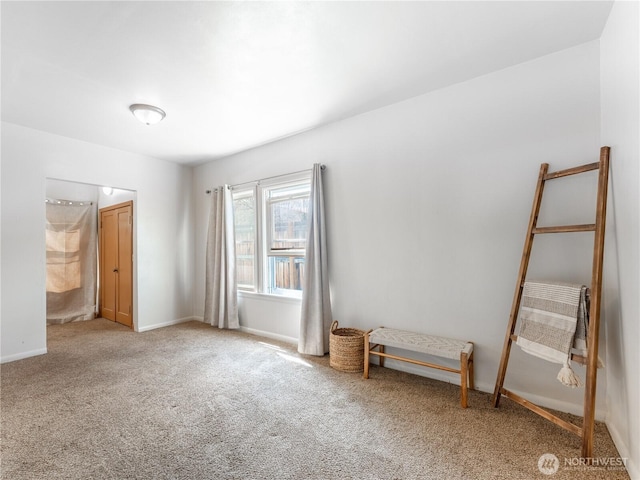 unfurnished bedroom with carpet and baseboards
