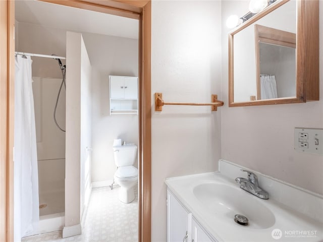bathroom featuring toilet, tile patterned floors, vanity, and a shower with curtain