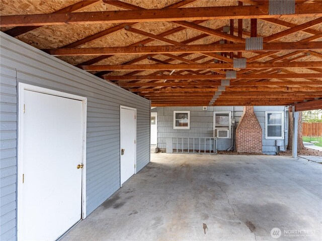 garage with cooling unit and a carport