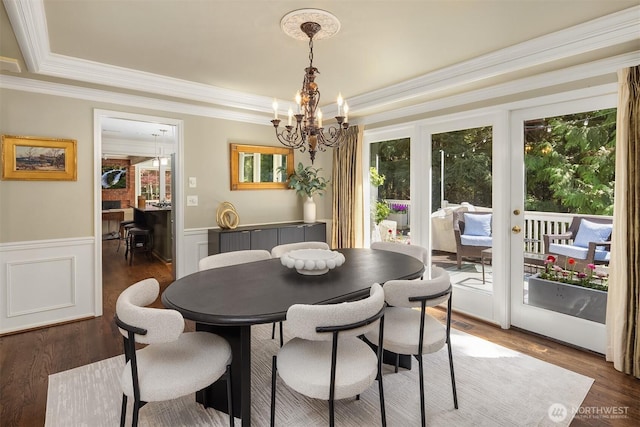 19625 NE 125th Ct, Woodinville, WA 98077 - dining area with a healthy amount of sunlight, crown molding, and an inviting chandelier