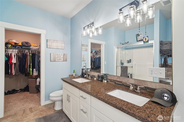 bathroom featuring an inviting chandelier, a sink, and visible vents