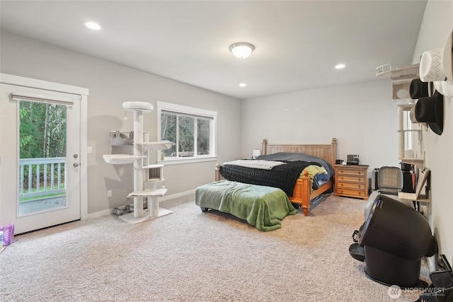 bedroom featuring access to exterior, visible vents, multiple windows, and carpet