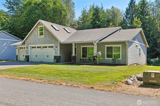 21401 127th Ave NE, Arlington, WA 98223 - view of front facade featuring asphalt driveway, a front yard, roof with shingles, a garage, and stone siding