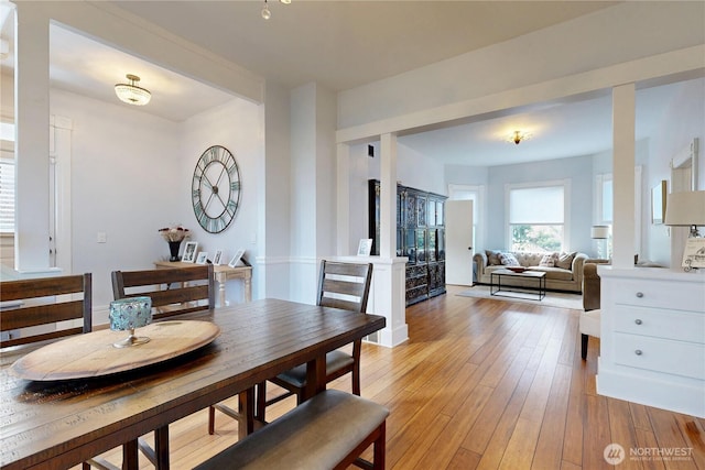 dining area with light wood-style floors