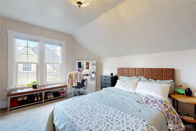 bedroom featuring carpet flooring, baseboards, and lofted ceiling