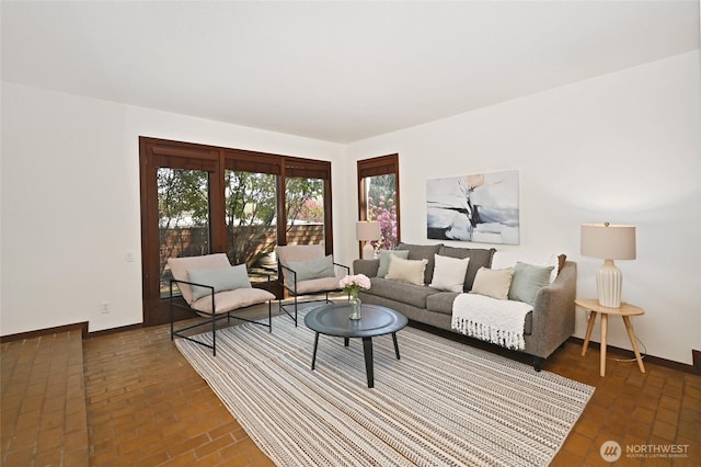 2312 W Crockett St, Seattle, WA 98199 - living room with baseboards and brick floor