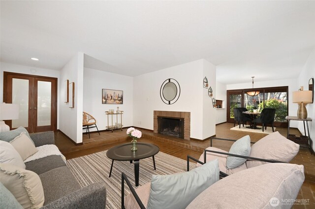 2312 W Crockett St, Seattle, WA 98199 - living area featuring baseboards, recessed lighting, a fireplace, french doors, and wood finished floors
