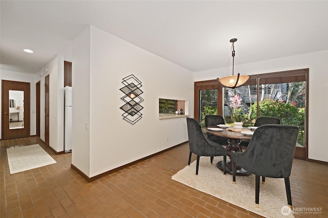 2312 W Crockett St, Seattle, WA 98199 - dining space with brick floor, baseboards, and recessed lighting