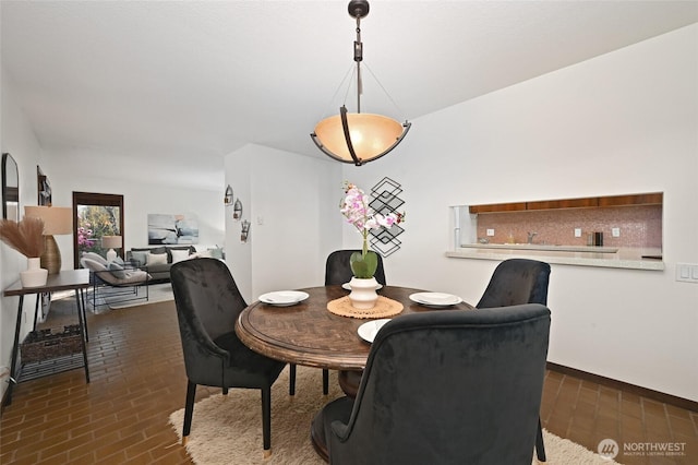 2312 W Crockett St, Seattle, WA 98199 - dining area featuring brick floor