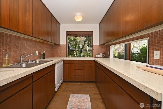 2312 W Crockett St, Seattle, WA 98199 - kitchen featuring a peninsula, decorative backsplash, a sink, and white dishwasher