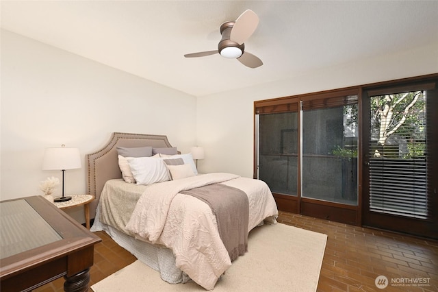 2312 W Crockett St, Seattle, WA 98199 - bedroom with brick floor and a ceiling fan