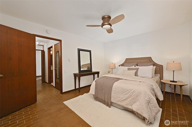 2312 W Crockett St, Seattle, WA 98199 - bedroom with brick floor and ceiling fan