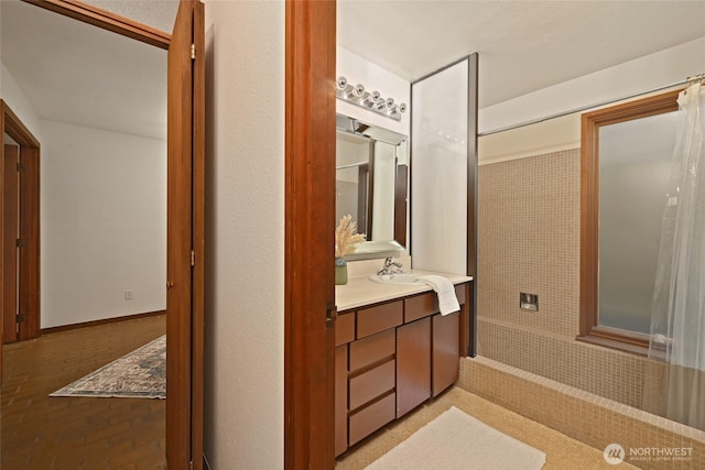 2312 W Crockett St, Seattle, WA 98199 - full bathroom featuring brick floor, vanity, baseboards, and a shower with curtain