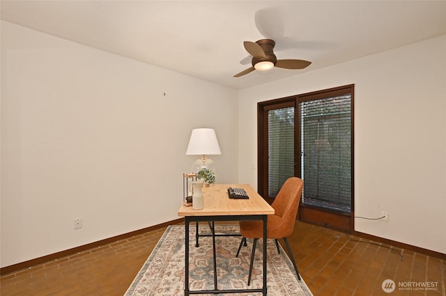 2312 W Crockett St, Seattle, WA 98199 - office space featuring brick floor, baseboards, and ceiling fan