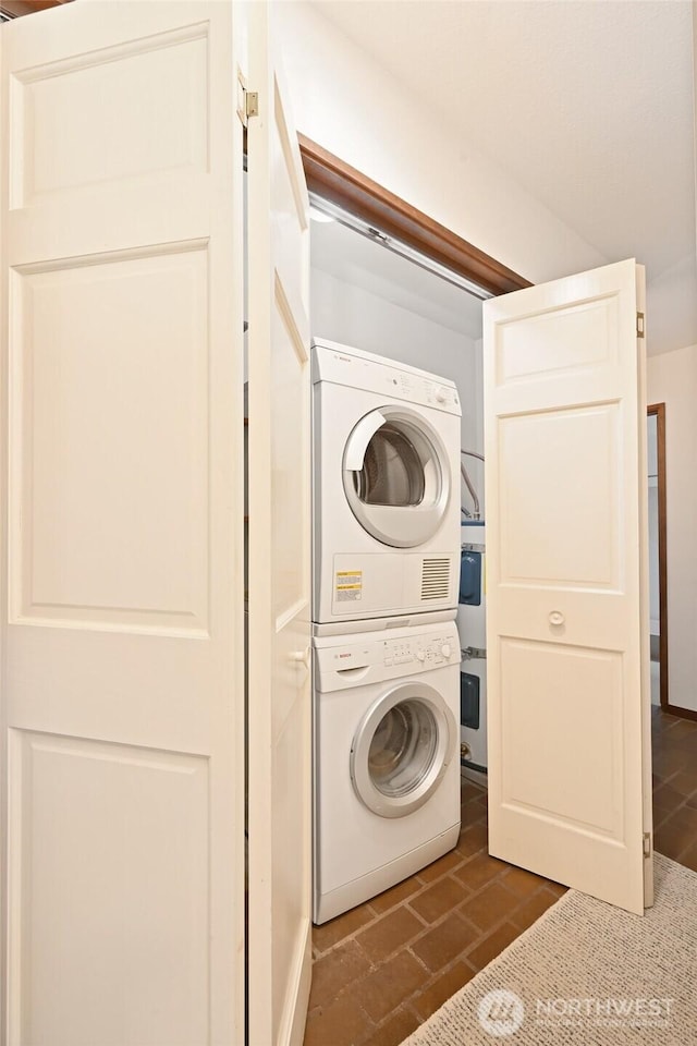2312 W Crockett St, Seattle, WA 98199 - laundry room featuring stacked washer / drying machine and laundry area