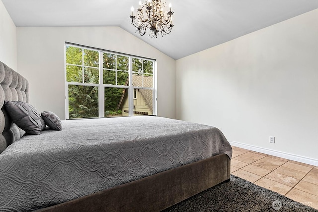 bedroom with a chandelier, tile patterned floors, vaulted ceiling, and baseboards
