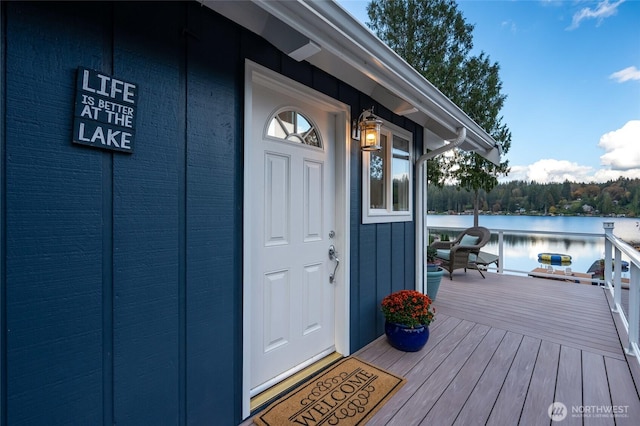 doorway to property featuring a water view