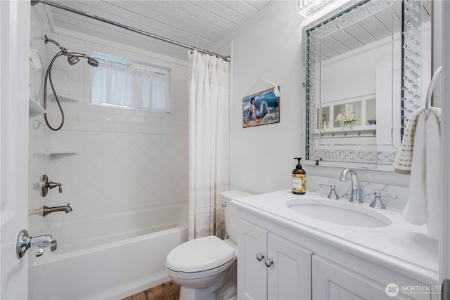 full bath featuring wood finished floors, shower / tub combo with curtain, vanity, and toilet