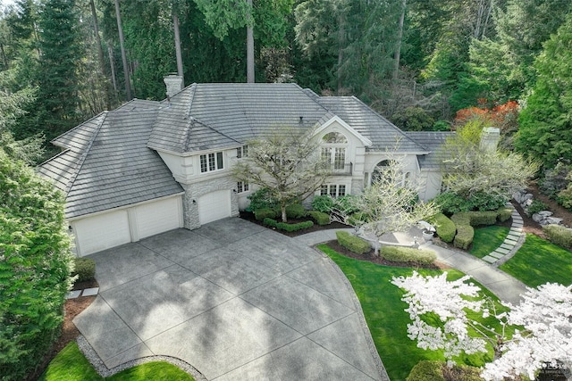 drone / aerial view with a wooded view