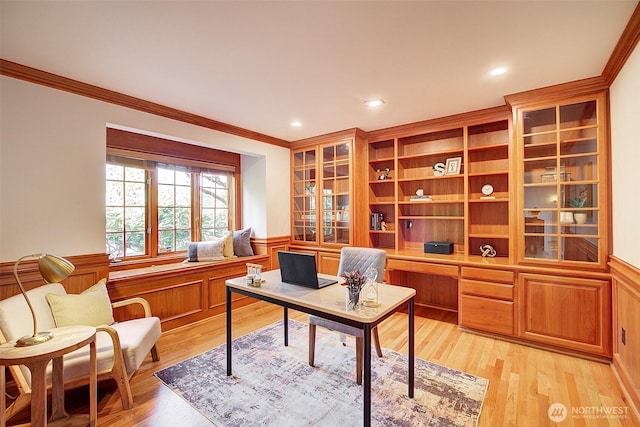 office space featuring crown molding, recessed lighting, light wood-type flooring, and a wainscoted wall