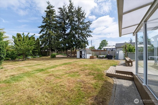 1903 Elhardt Dr, Camano Island, WA 98282 - view of yard featuring a storage shed, an outdoor structure, and a deck