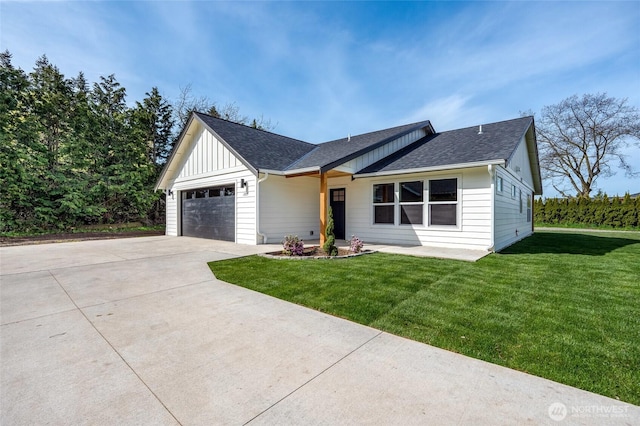 1725 Main St, Lynden, WA 98264 - view of front of property featuring board and batten siding, a front yard, an attached garage, a shingled roof, and concrete driveway
