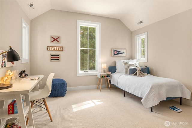 carpeted bedroom featuring baseboards, visible vents, and lofted ceiling