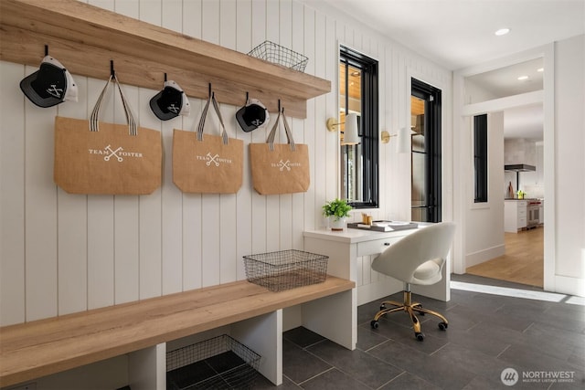 mudroom featuring recessed lighting and dark tile patterned floors