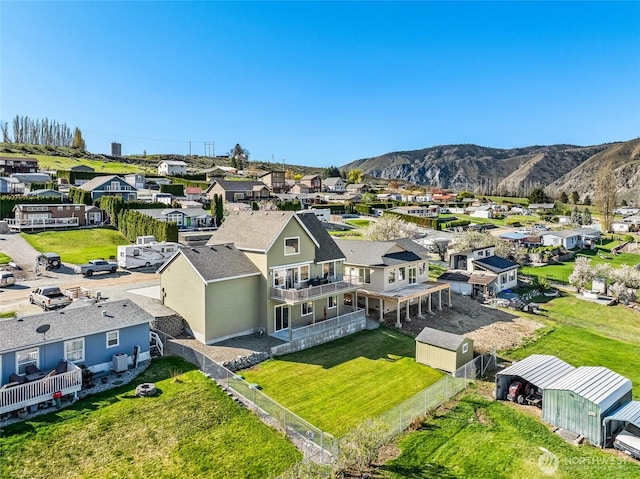 drone / aerial view featuring a mountain view and a residential view