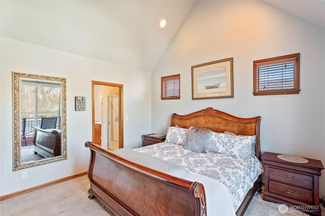 carpeted bedroom featuring high vaulted ceiling, ensuite bathroom, and baseboards