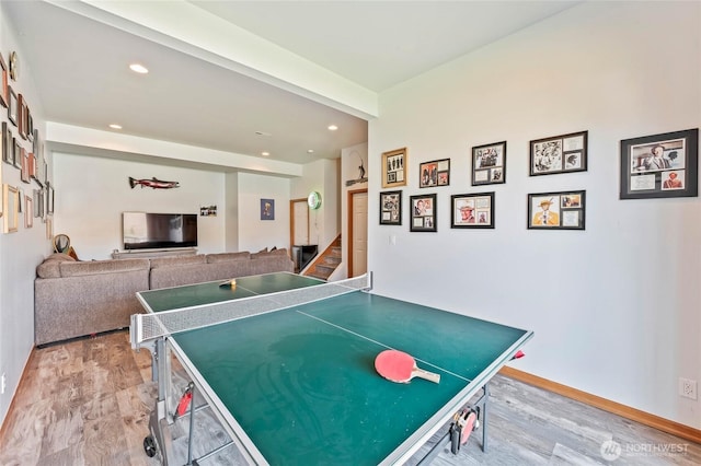 rec room featuring recessed lighting, light wood finished floors, and baseboards