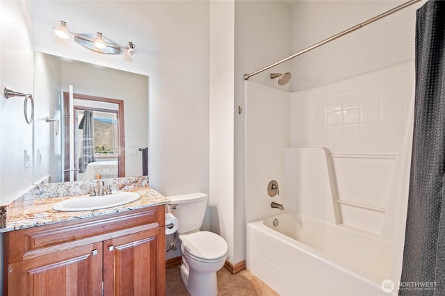 bathroom featuring toilet, shower / bathing tub combination, baseboards, tile patterned flooring, and vanity