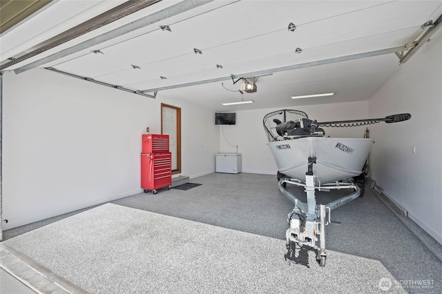 garage featuring baseboards and a garage door opener