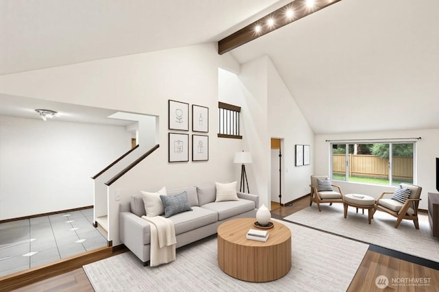 4524 Carnaby St, Kent, WA 98032 - living area with wood finished floors, high vaulted ceiling, beamed ceiling, and baseboards