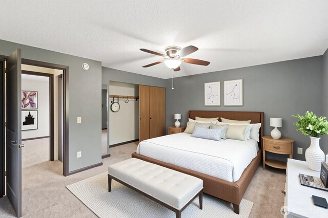 4524 Carnaby St, Kent, WA 98032 - bedroom with light carpet, a closet, a ceiling fan, and baseboards